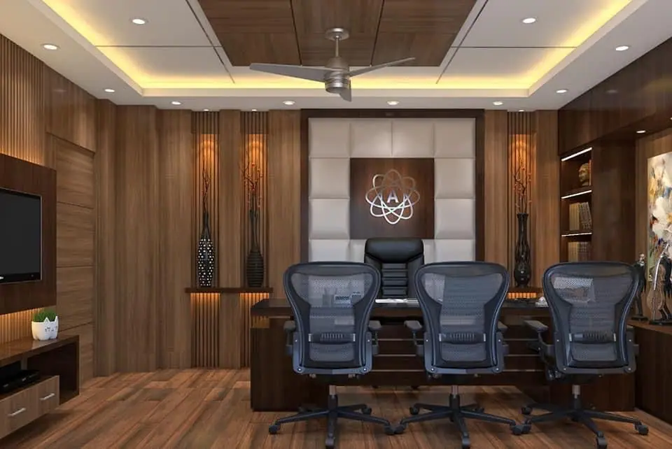Managing director’s cabin with a padded feature wall, a timber-panelled ceiling and mesh chairs at the desk