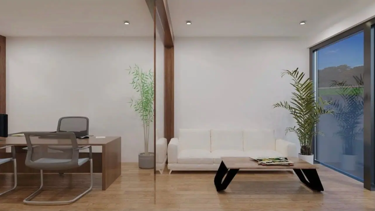 Office cabin with a work desk, a white sofa and a full-height window