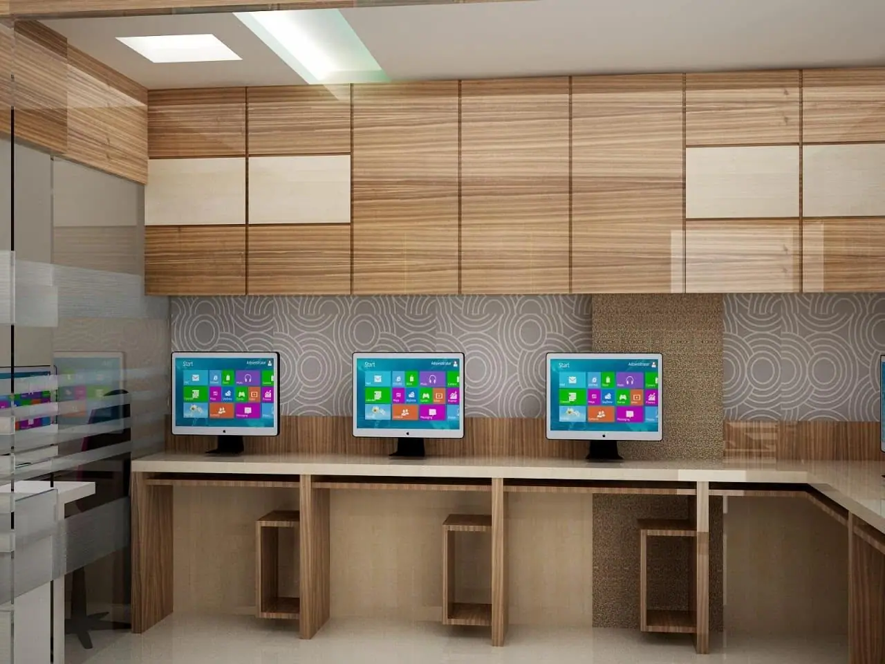 Row of computer workstations below a wood and cream panelled storage wall