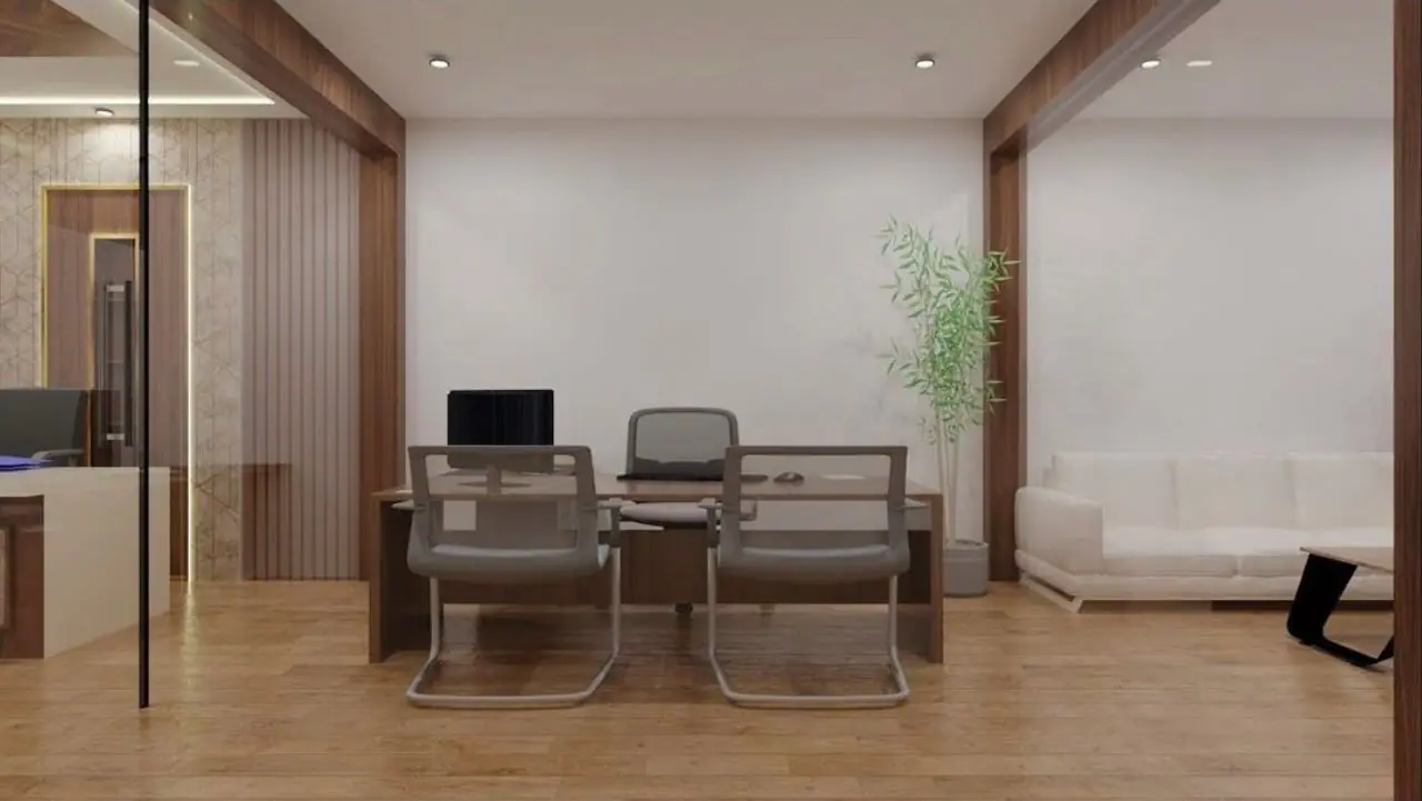 Office cabin with a meeting desk, a white sofa and an indoor plant