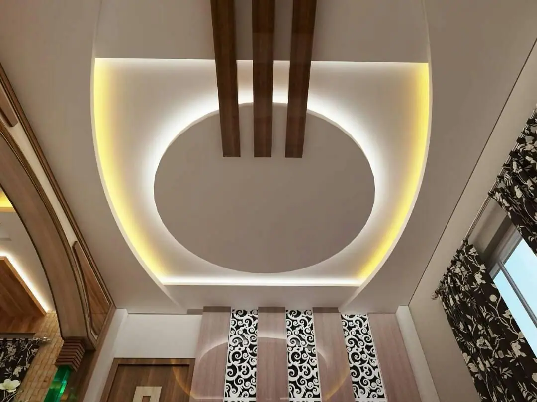 False ceiling design with an oval cove-lit recess and timber beams